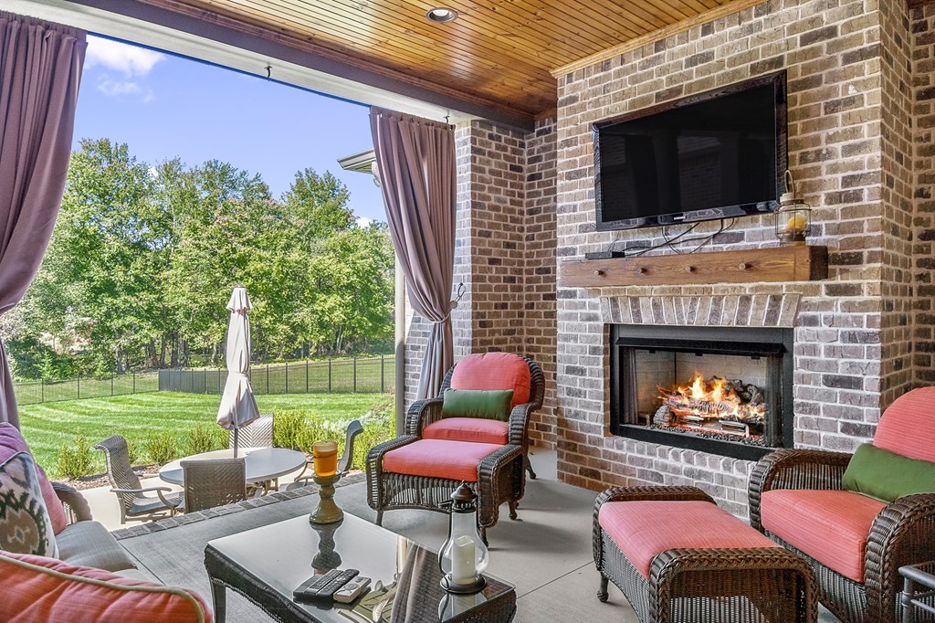 504 McCulley Road Cookeville, TN 38506 - Photo 13 of 70 a outdoor space with patio fireplace couches and a fireplace