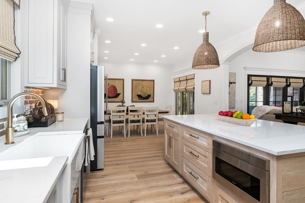 504 McCulley Road Cookeville, TN 38506 - Photo 25 of 70 a kitchen with stainless steel appliances granite countertop a sink dishwasher a stove and a dining table with wooden floor