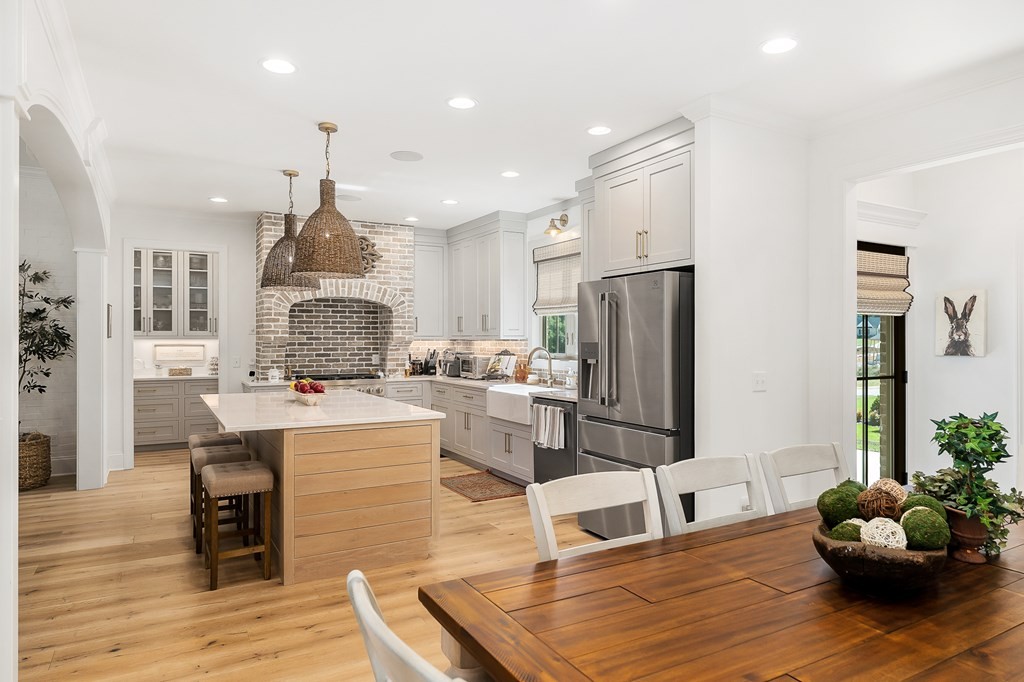 504 McCulley Road Cookeville, TN 38506 - Photo 27 of 70 a kitchen with stainless steel appliances kitchen island granite countertop a refrigerator and a stove top oven