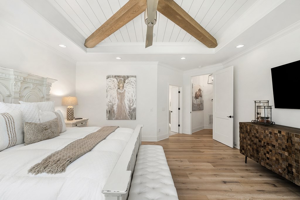 504 McCulley Road Cookeville, TN 38506 - Photo 32 of 70 a spacious bedroom with a bed and a flat screen tv