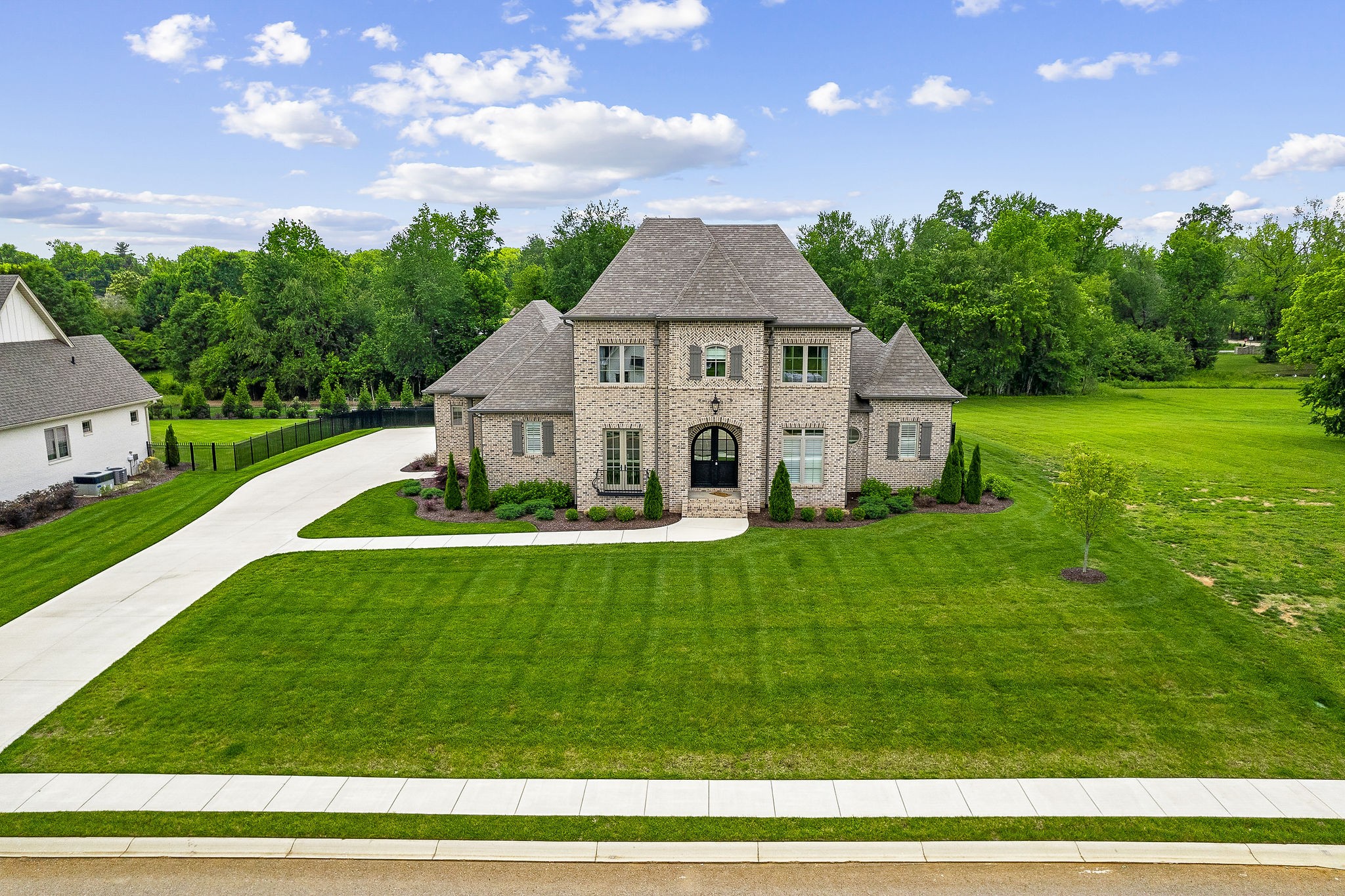 504 McCulley Road Cookeville, TN 38506 - Photo 4 of 70 a view of a house with a big yard potted plants and large tree