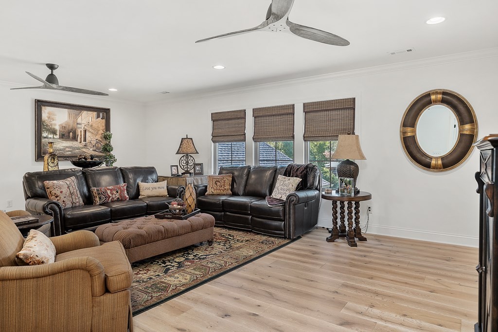 504 McCulley Road Cookeville, TN 38506 - Photo 41 of 70 a living room with furniture a large window and wooden floor