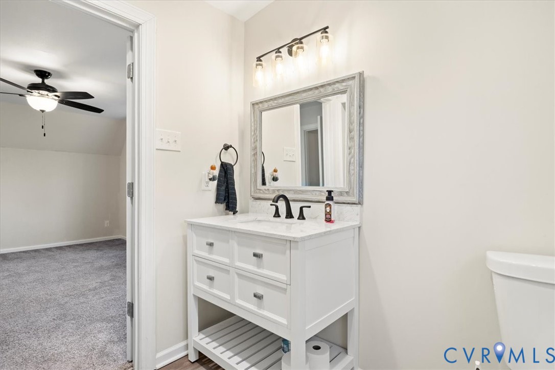 11655 Chatham Road Prince George, VA 23875 - Photo 32 of 48 a bathroom with a sink vanity and a mirror