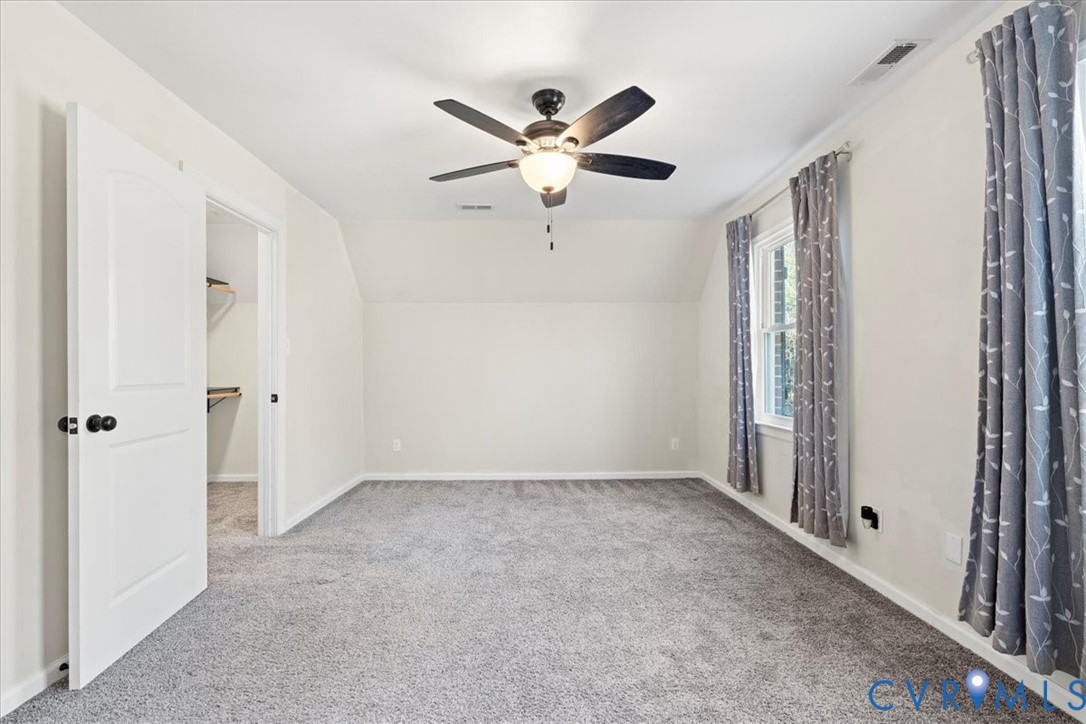 11655 Chatham Road Prince George, VA 23875 - Photo 36 of 48 a view of a livingroom with a ceiling fan and window