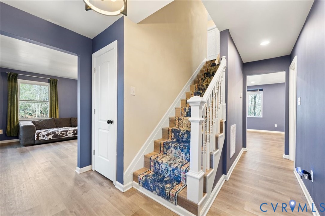 11655 Chatham Road Prince George, VA 23875 - Photo 46 of 48 a view of a livingroom with wooden floor and stairs