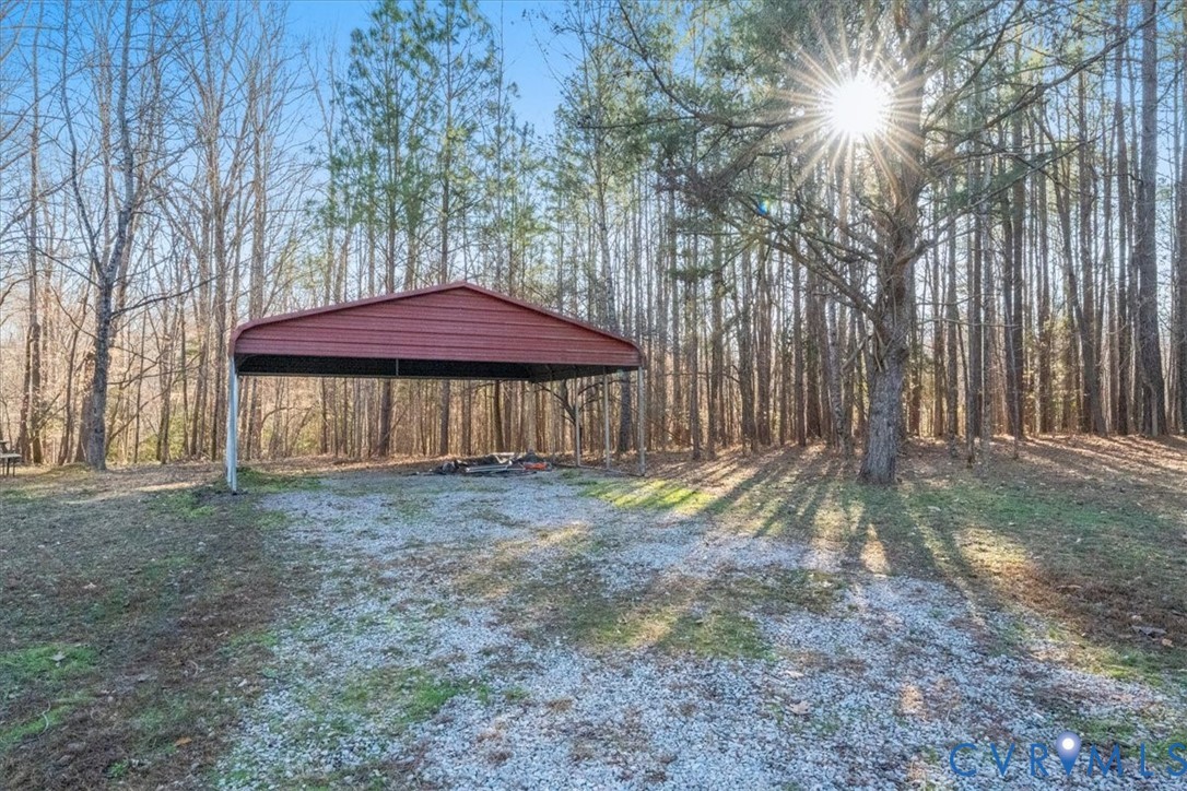 11655 Chatham Road Prince George, VA 23875 - Photo 6 of 48 a view of a house with a yard and sitting area
