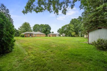 129 Sunset Boulevard Hermitage, PA 16148 - Photo 4 of 34 a view of a house with a yard and a garden