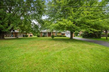 129 Sunset Boulevard Hermitage, PA 16148 - Photo 6 of 34 a view of a swimming pool is sitting in the grass