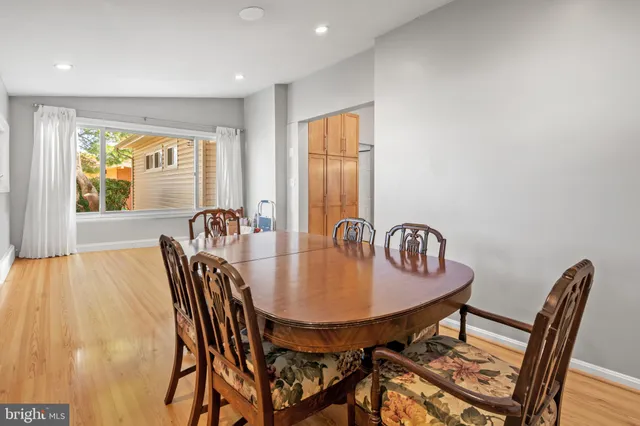 a view of a dining room with furniture and window