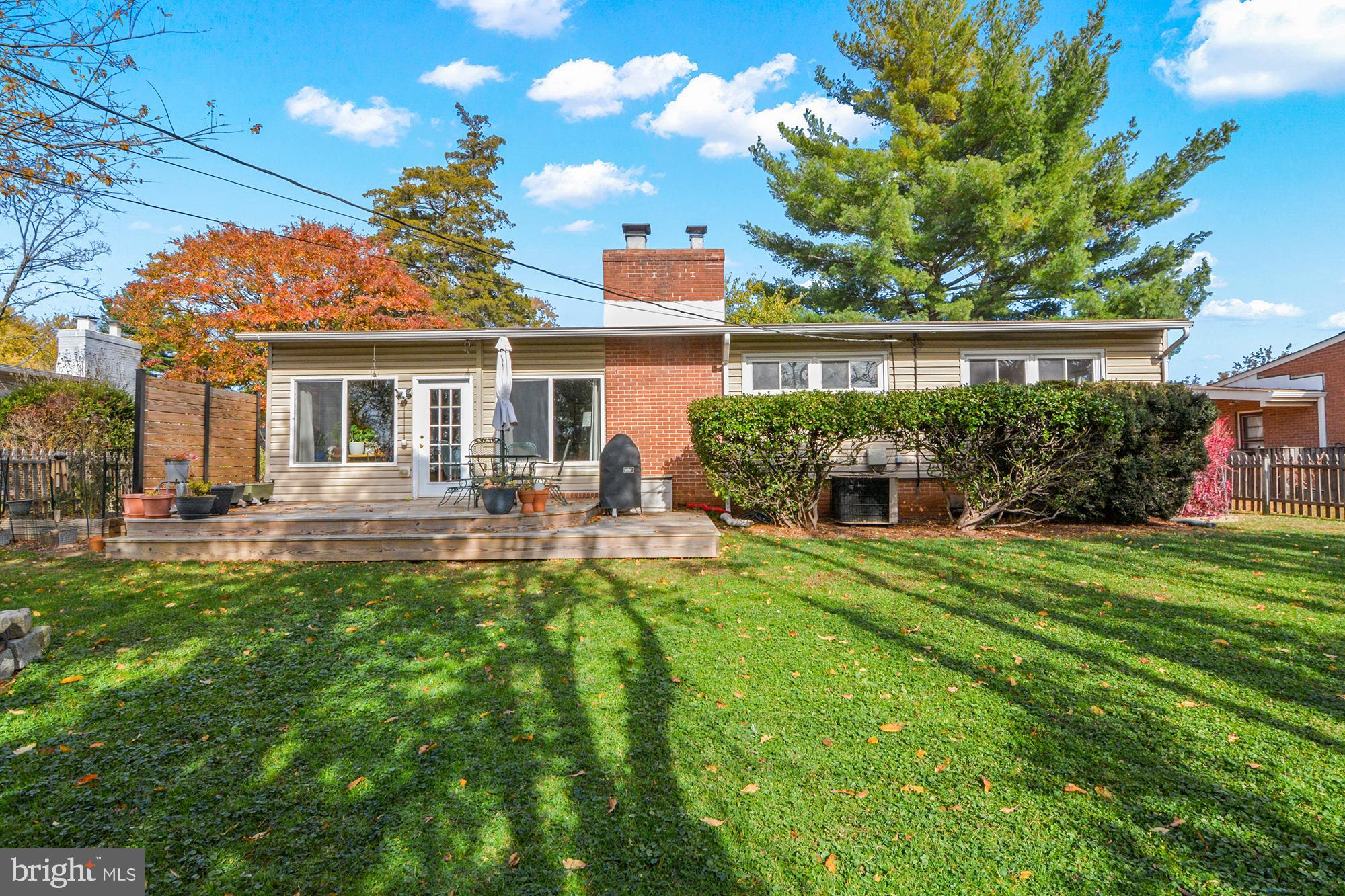 2419 Sylvale Road Baltimore, MD 21209 - Photo 28 of 29 a view of a house with backyard sitting area and garden