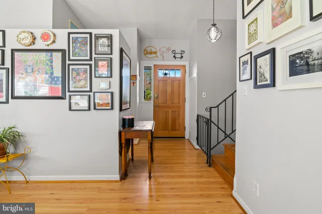 a view of an entryway with wooden floor