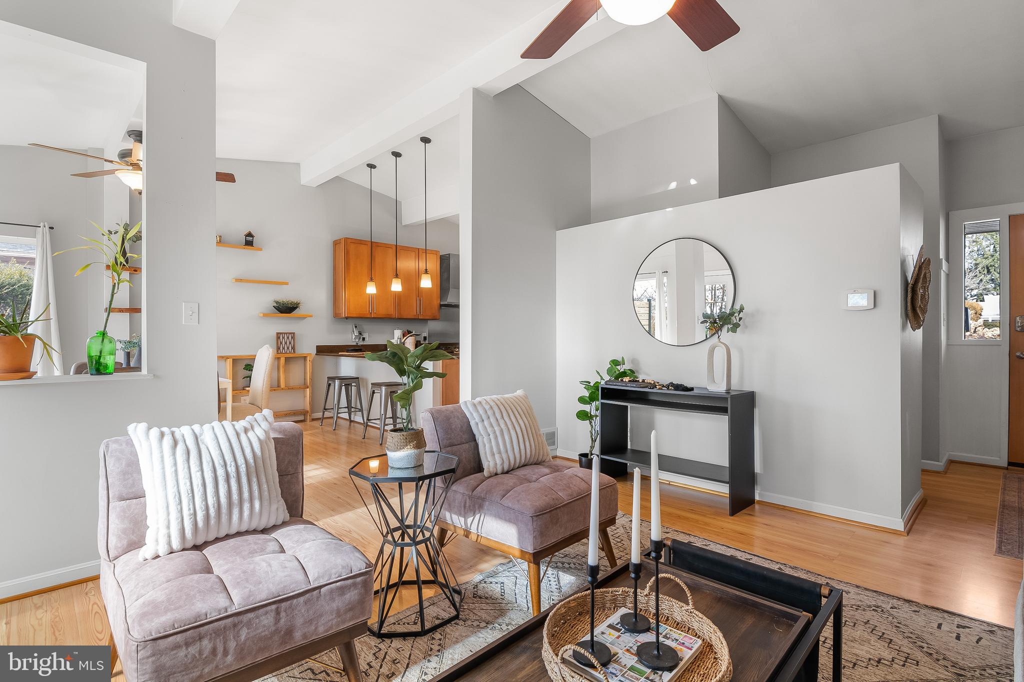2419 Sylvale Road Baltimore, MD 21209 - Photo 5 of 29 a living room with furniture a mirror and wooden floor