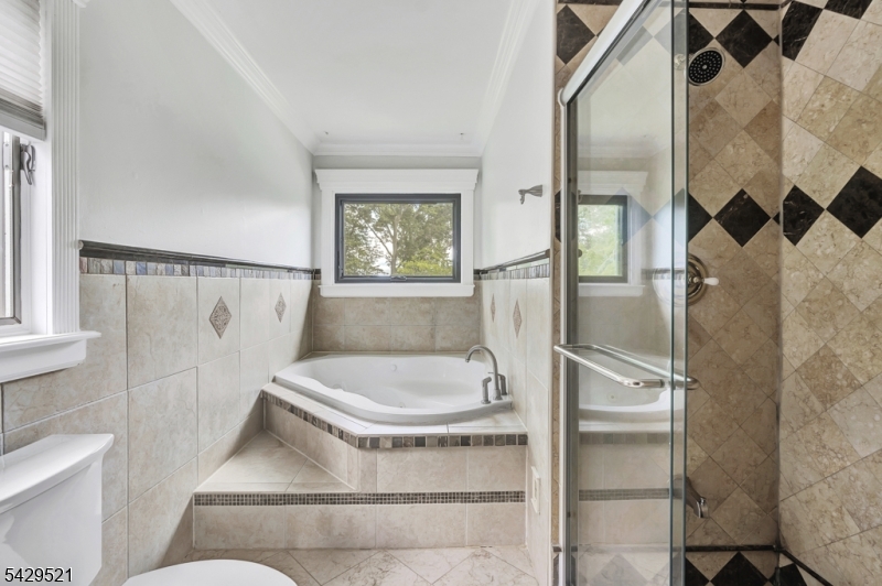 136 Carlough Road Upper Saddle River, NJ 07458 - Photo 16 of 32 a bathroom with a sink and shower