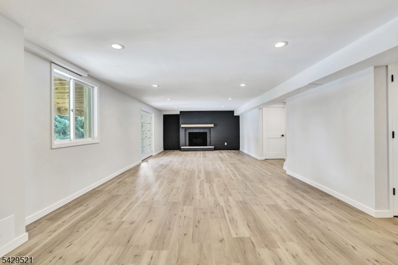 136 Carlough Road Upper Saddle River, NJ 07458 - Photo 22 of 32 a view of an empty room with wooden floor and a window