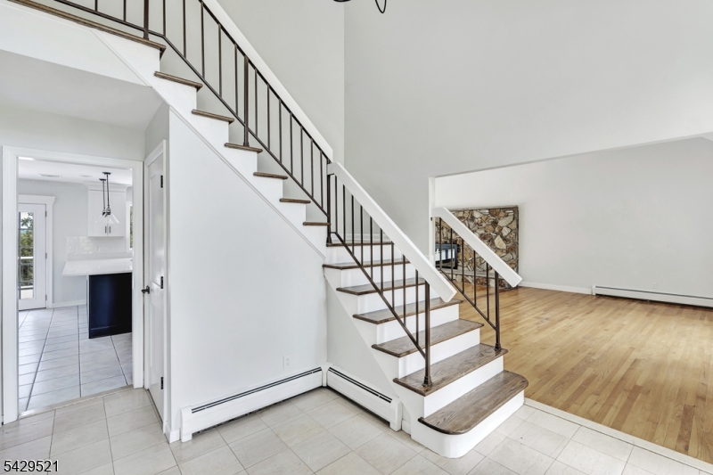 136 Carlough Road Upper Saddle River, NJ 07458 - Photo 4 of 32 a view of entryway livingroom and hall with wooden floor