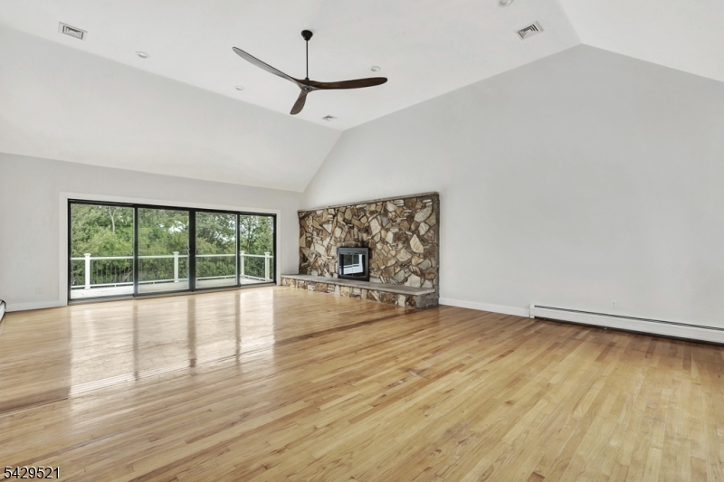 136 Carlough Road Upper Saddle River, NJ 07458 - Photo 8 of 32 a view of an empty room with wooden floor and a window