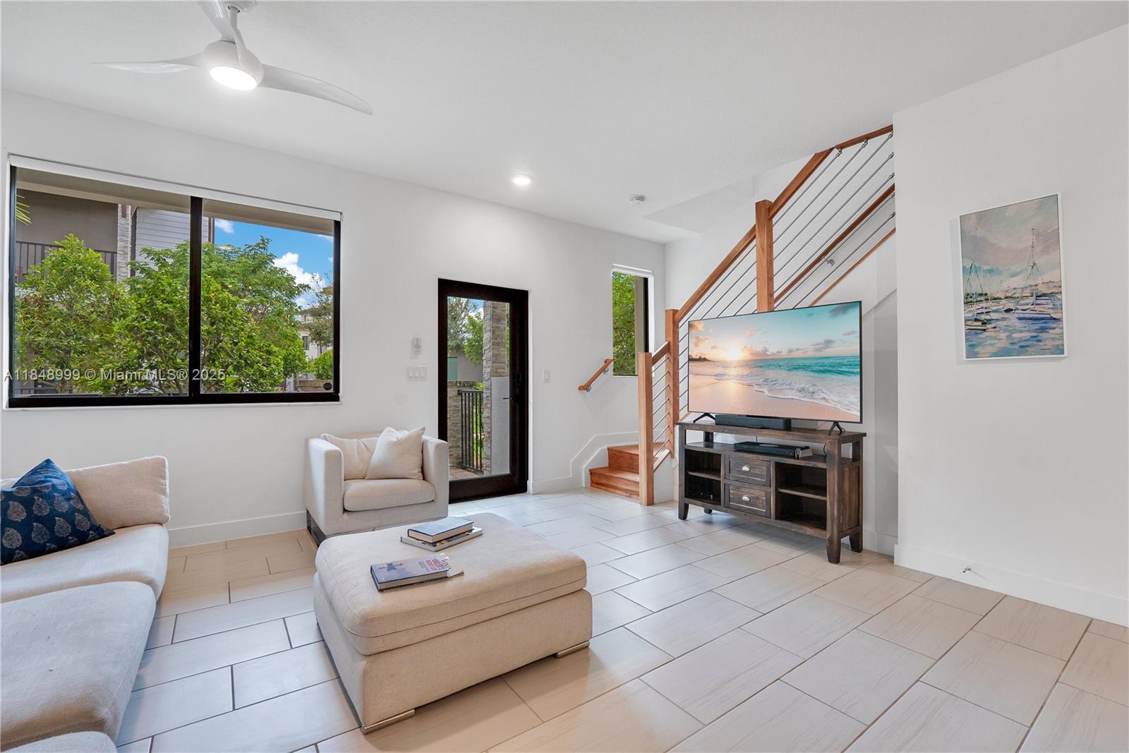 4952 Northwest 83rd Path Doral, FL 33166 - Photo 15 of 49 a living room with furniture and a flat screen tv