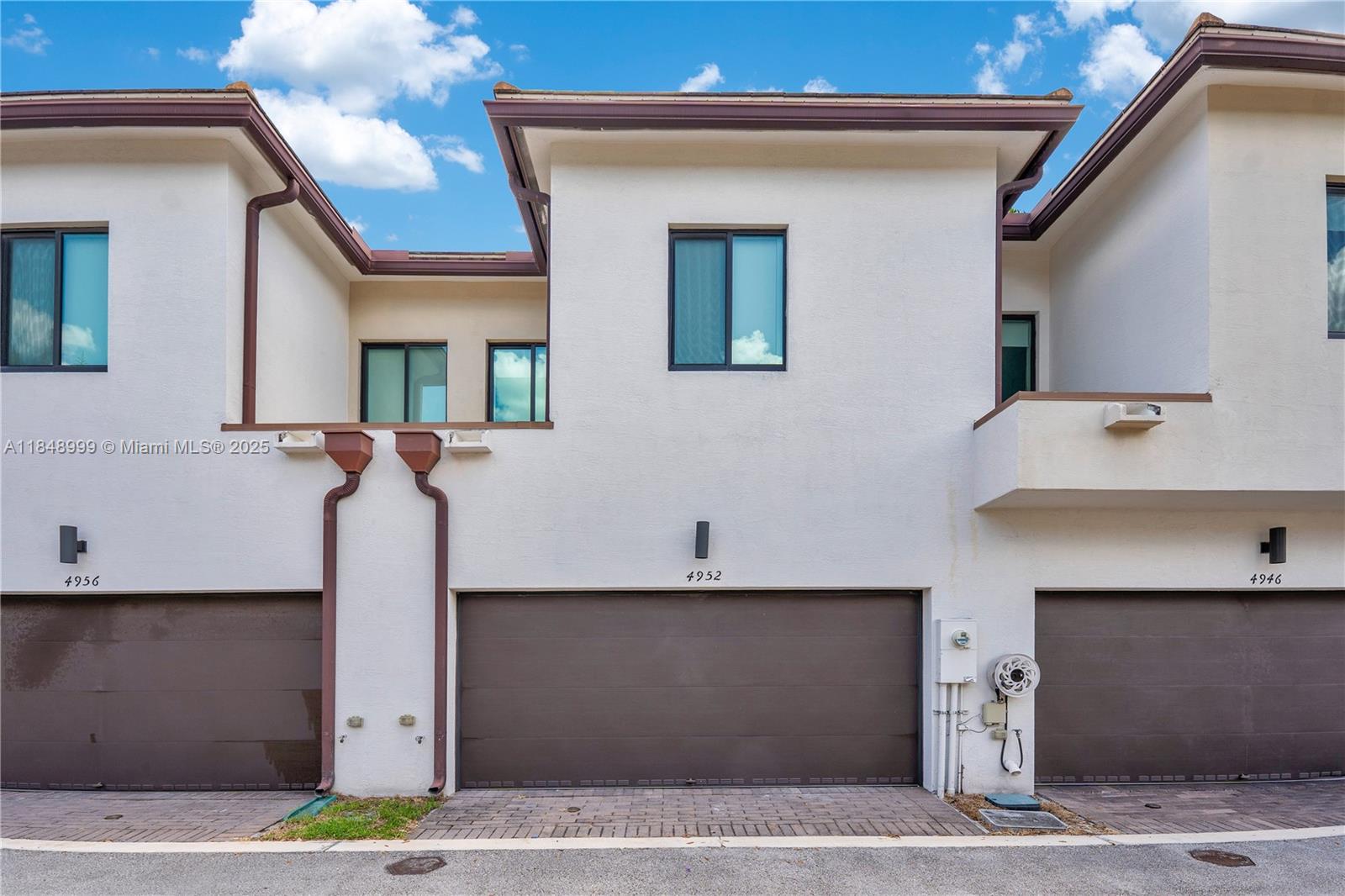 4952 Northwest 83rd Path Doral, FL 33166 - Photo 30 of 49 a front view of a house with garage