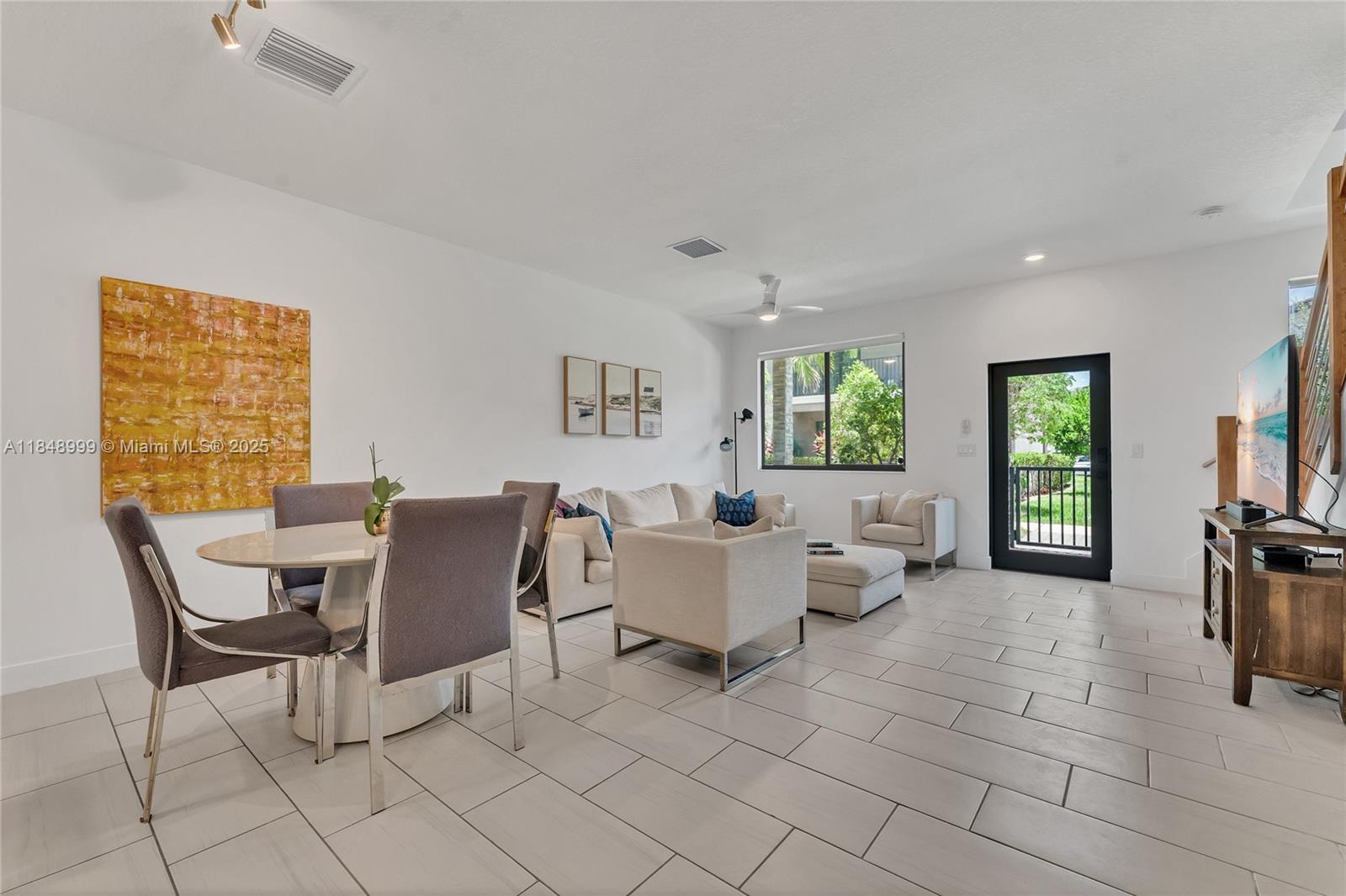 4952 Northwest 83rd Path Doral, FL 33166 - Photo 8 of 49 a living room with furniture and a window