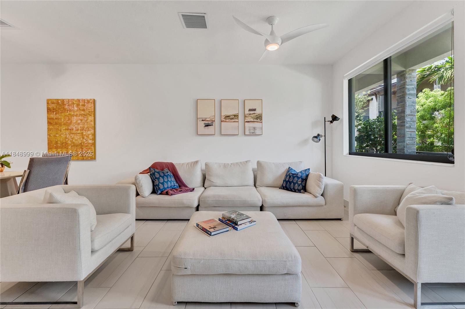 4952 Northwest 83rd Path Doral, FL 33166 - Photo 10 of 49 a living room with furniture and a large window