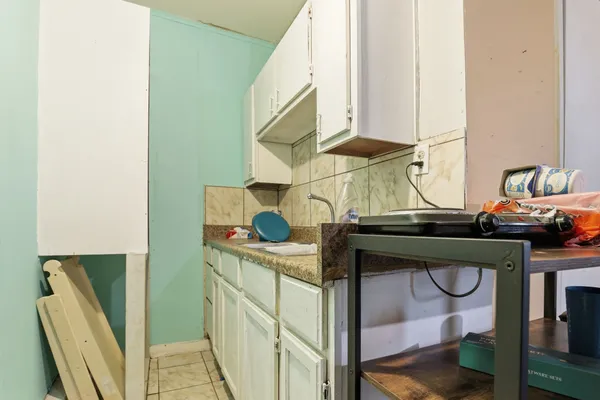 a utility room with two washing machine