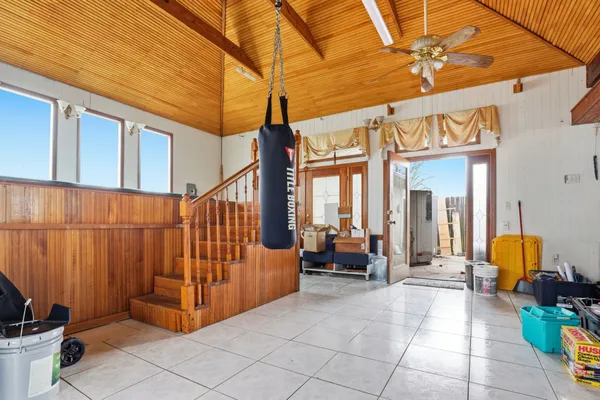 a view of living room filled with furniture and furniture