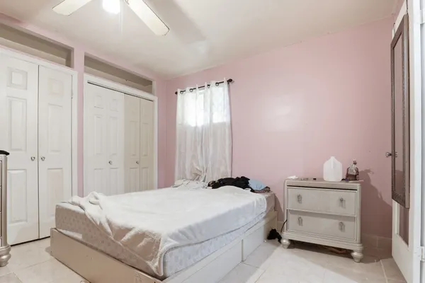 a bedroom with a bed and a cabinets