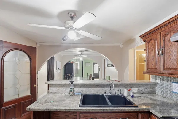 a view of living room with granite countertop furniture and fireplace