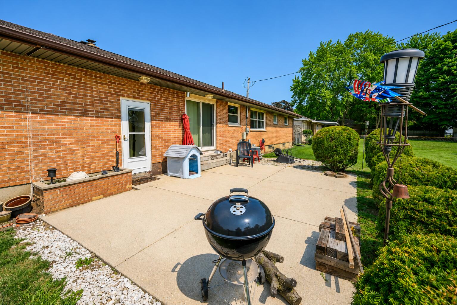 4428 Phoenix Drive Springfield, OH 45503 - Photo 29 of 35 Plenty of relaxation and recreation in this wide open backyard. Expansive patio accessible from eat in area sliders