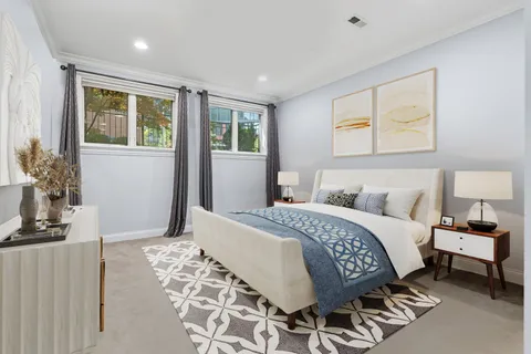 a bedroom with a large bed and a window