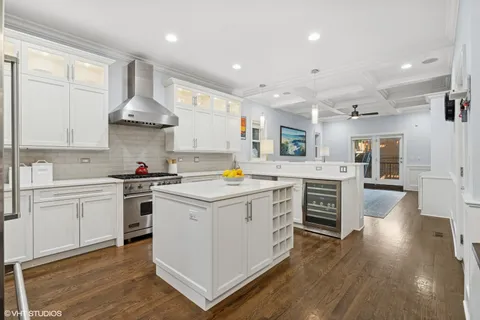 a kitchen with a stove a sink and a refrigerator
