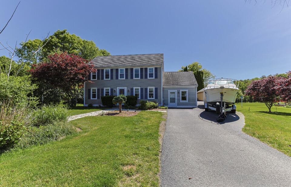 30 Sheffield Place Mashpee, MA 02649 - Photo 4 of 38 a view of house with outdoor seating and yard