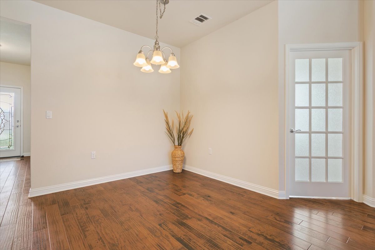 108 Cathedral Mountain Pass Georgetown, TX 78633 - Photo 6 of 36 a view of a room with wooden floor and a window