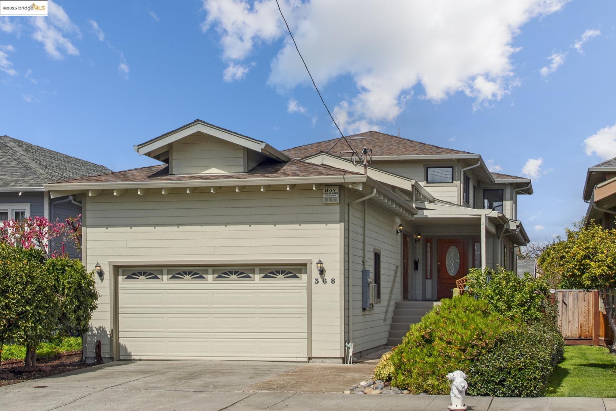 Undisclosed Address San Leandro, CA 94577 - Photo 1 of 50 a front view of a house with a yard