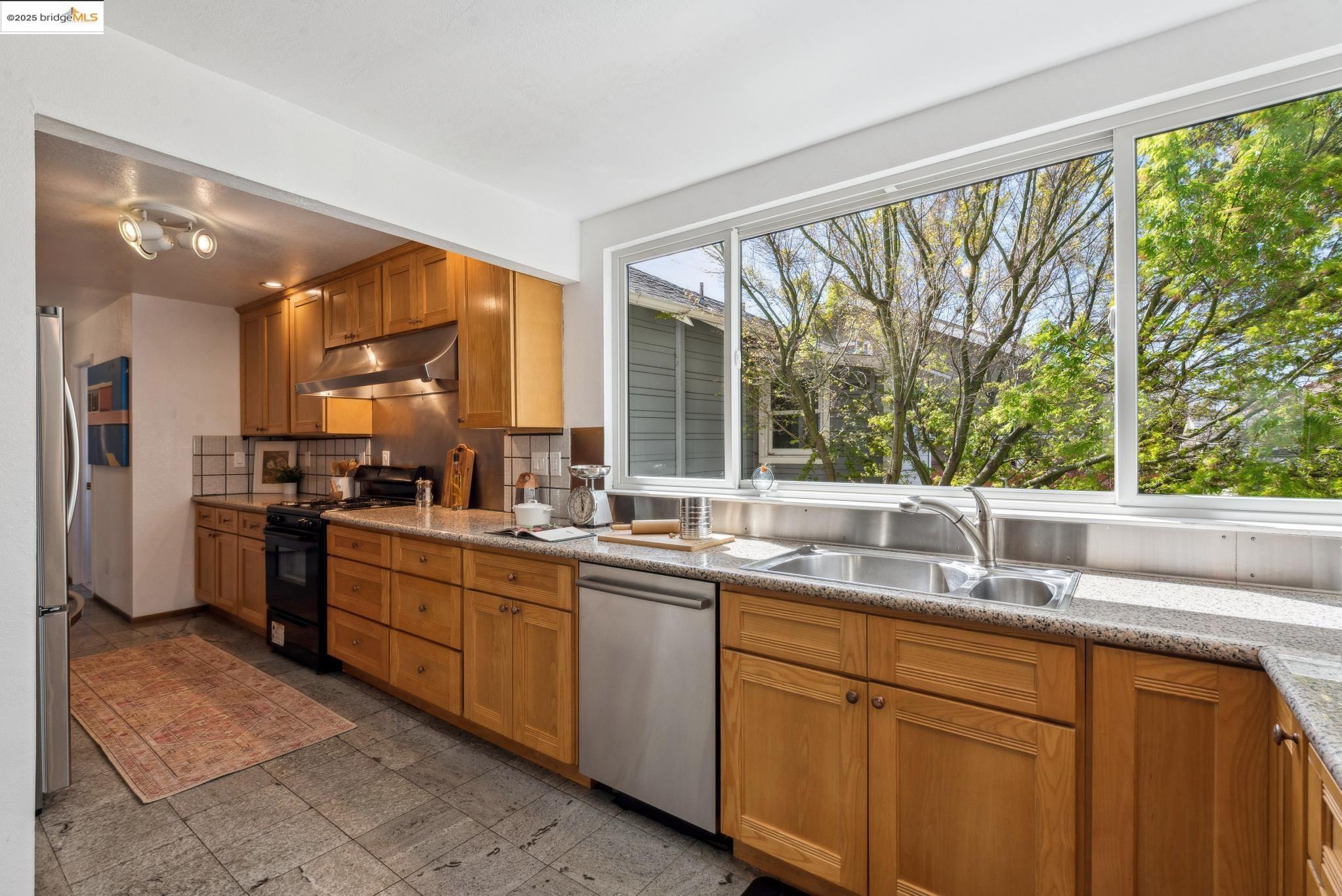 Undisclosed Address San Leandro, CA 94577 - Photo 16 of 50 a kitchen with a sink and large window