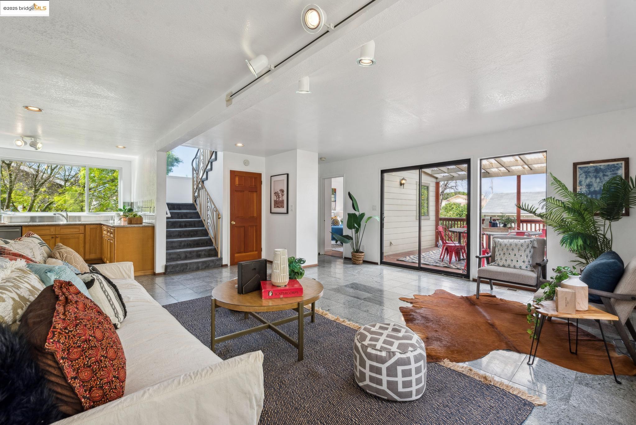 Undisclosed Address San Leandro, CA 94577 - Photo 19 of 50 a living room with furniture and a floor to ceiling window