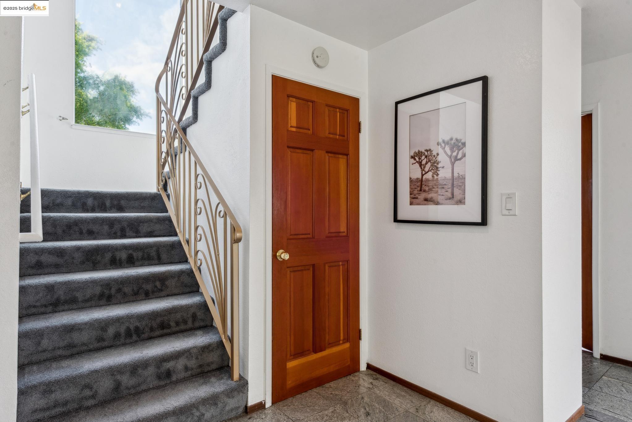 Undisclosed Address San Leandro, CA 94577 - Photo 23 of 50 a view of staircase with white walls and a window