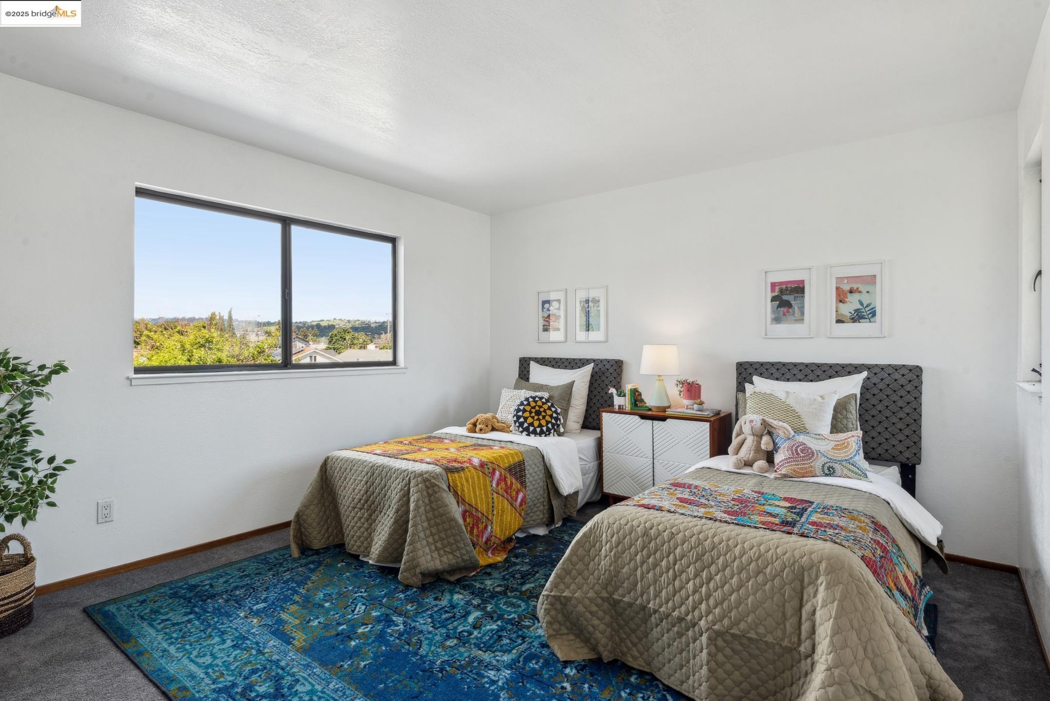 Undisclosed Address San Leandro, CA 94577 - Photo 29 of 50 a bedroom with two beds and a window