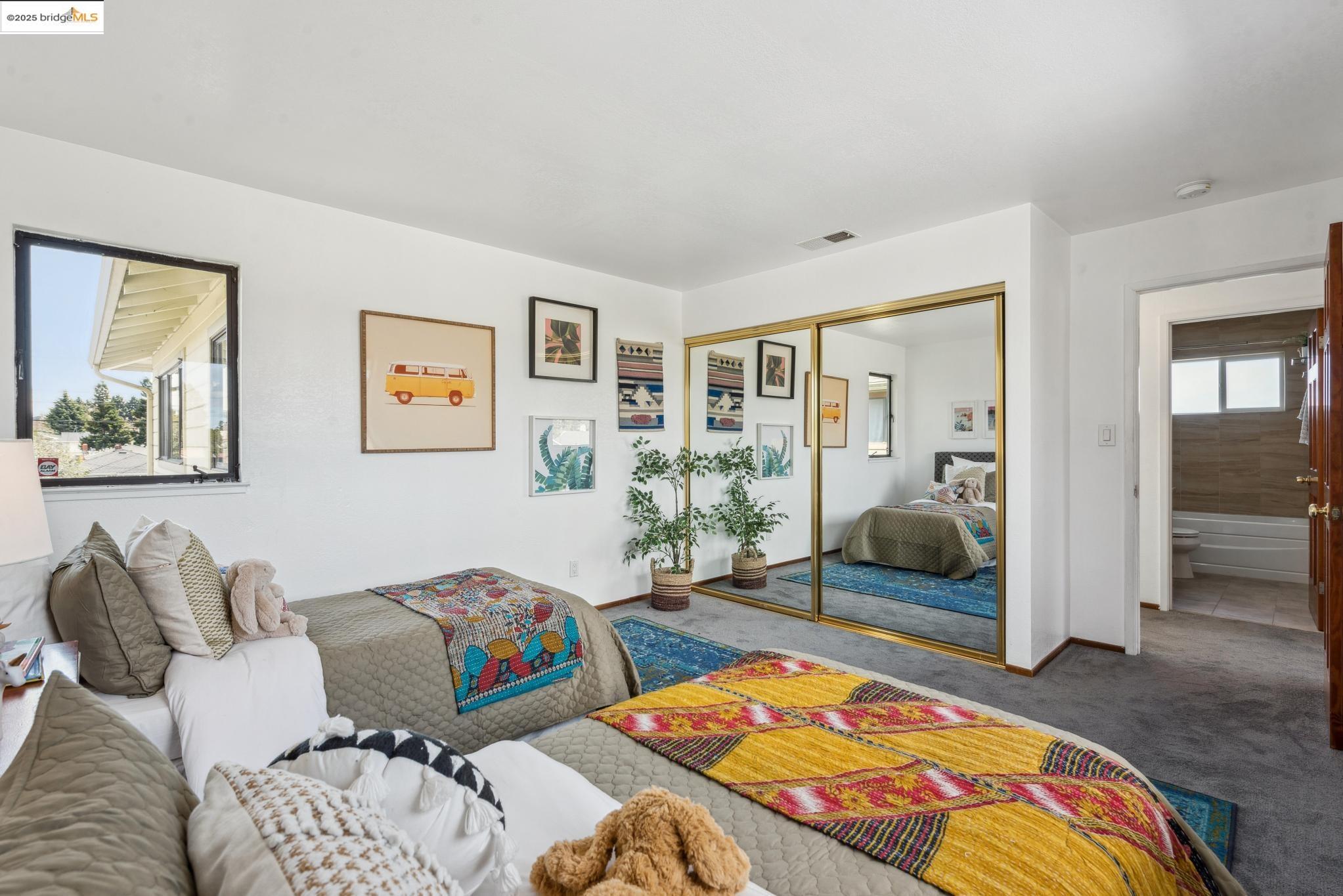 Undisclosed Address San Leandro, CA 94577 - Photo 31 of 50 a bedroom with bed and glass windows