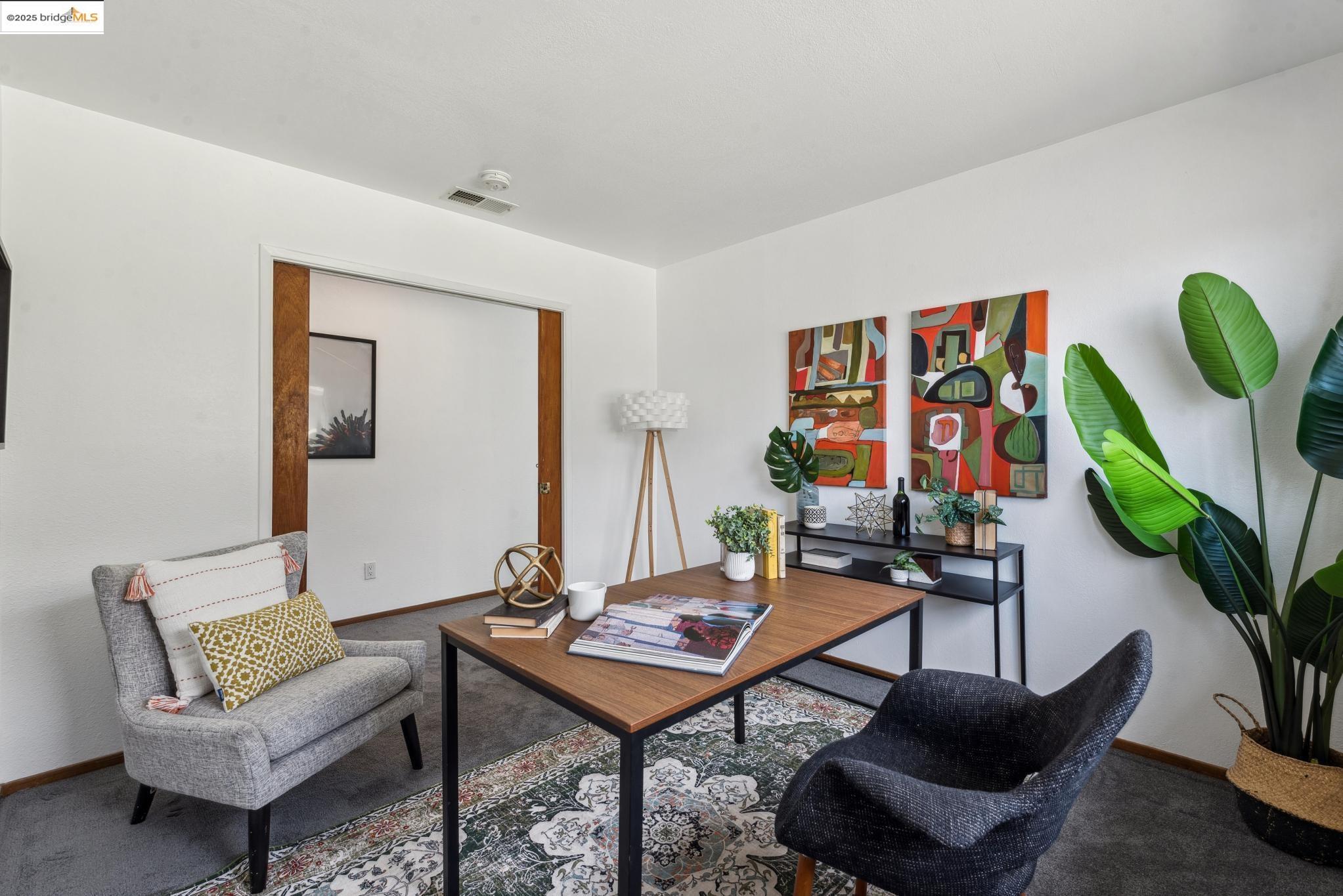 Undisclosed Address San Leandro, CA 94577 - Photo 33 of 50 a living room with furniture a rug and a potted plant
