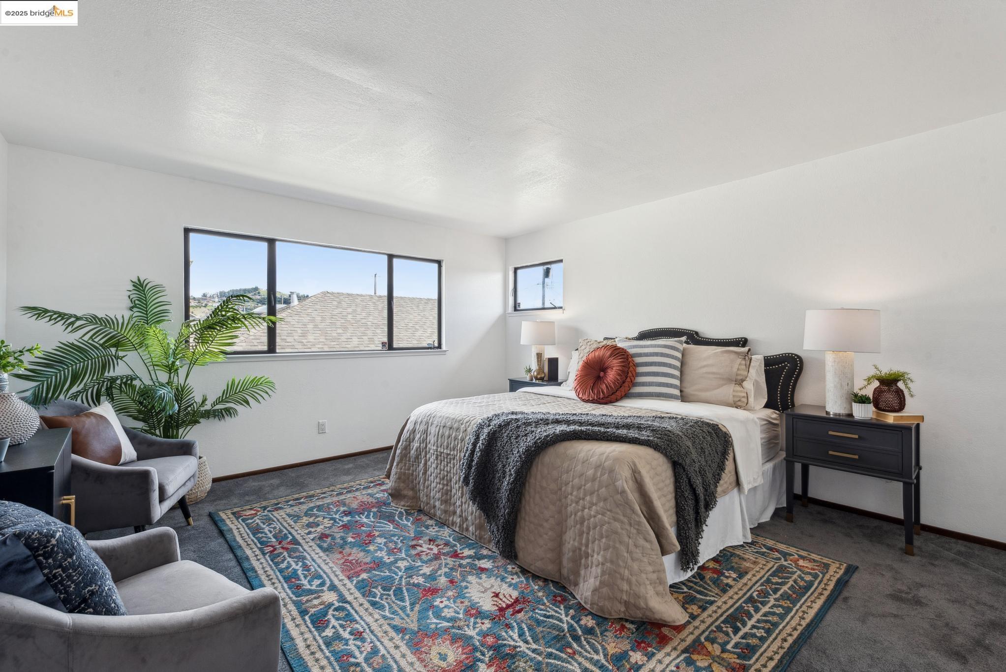 Undisclosed Address San Leandro, CA 94577 - Photo 34 of 50 a bedroom with a bed and a couch