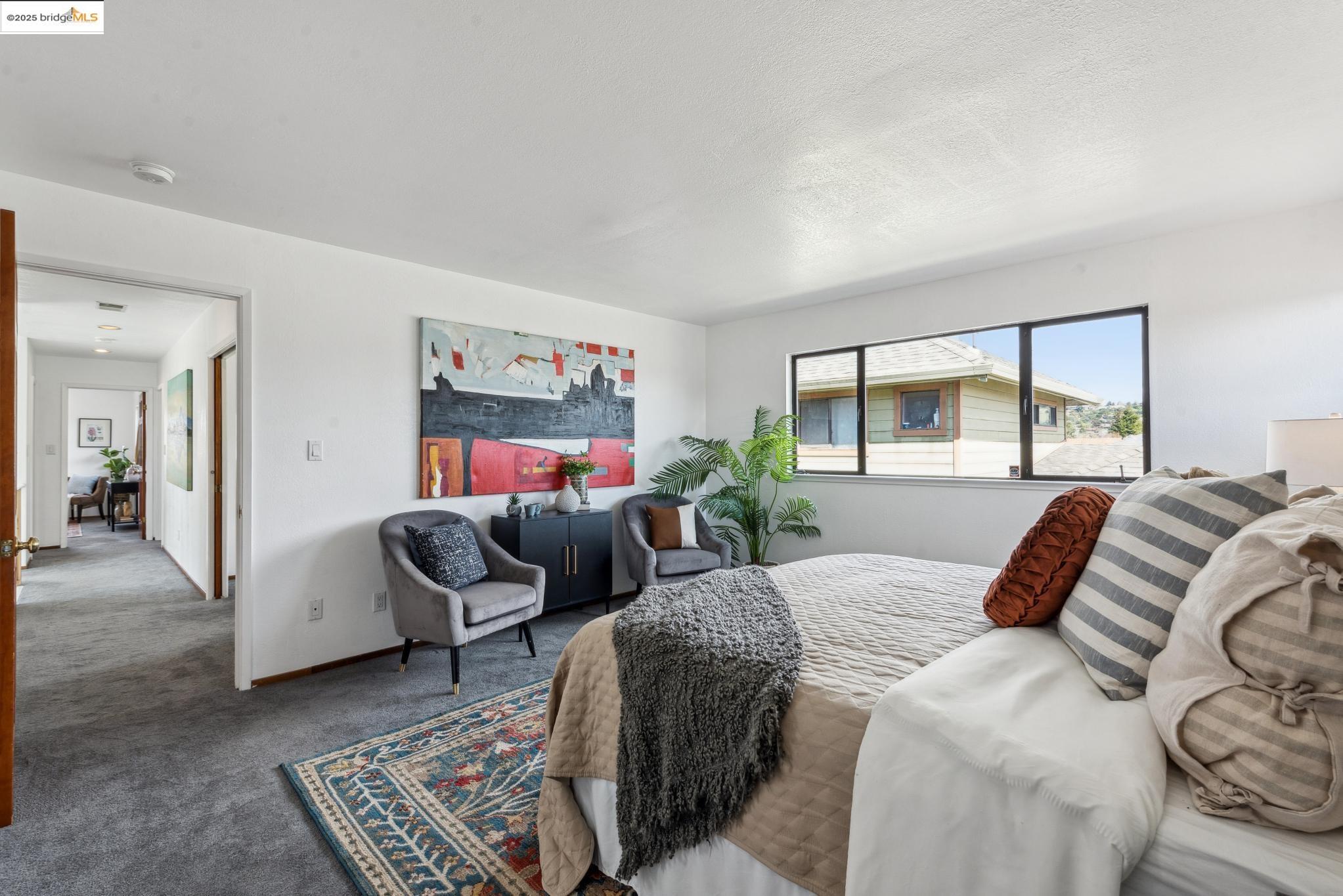 Undisclosed Address San Leandro, CA 94577 - Photo 35 of 50 a bedroom with a bed and glass window