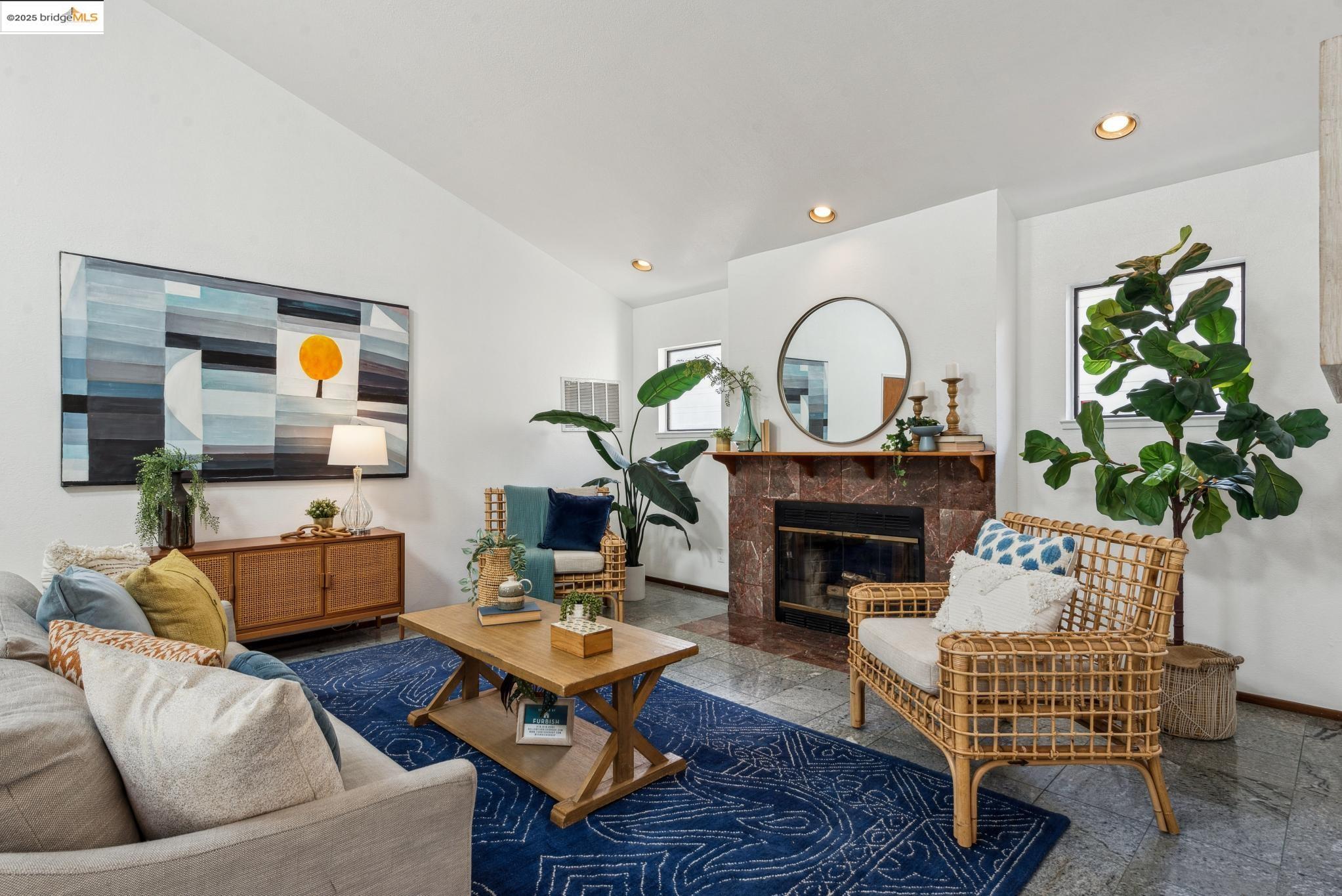 Undisclosed Address San Leandro, CA 94577 - Photo 5 of 50 a living room with furniture a fireplace and a potted plant