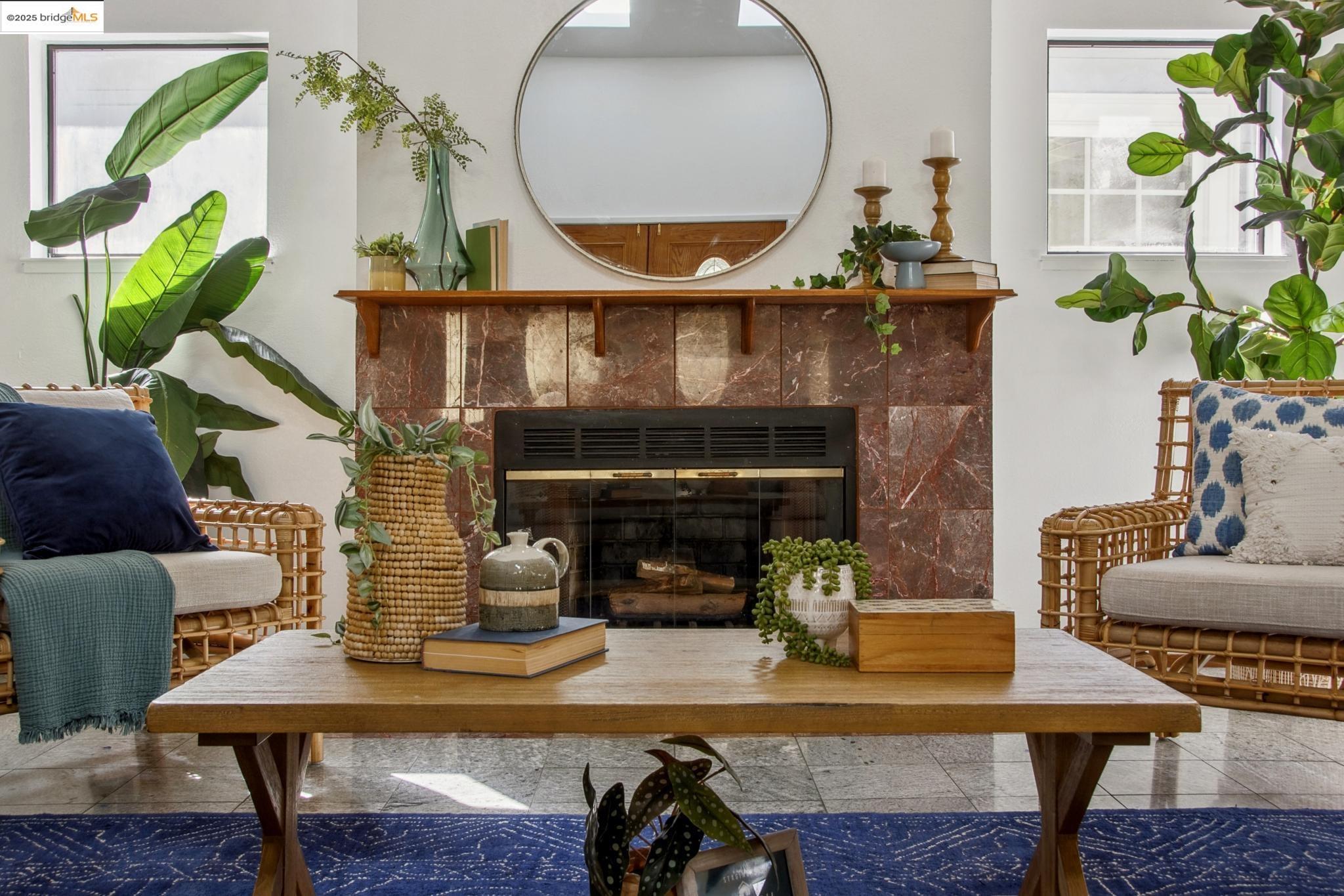 Undisclosed Address San Leandro, CA 94577 - Photo 6 of 50 a living room with furniture a fireplace and a potted plant