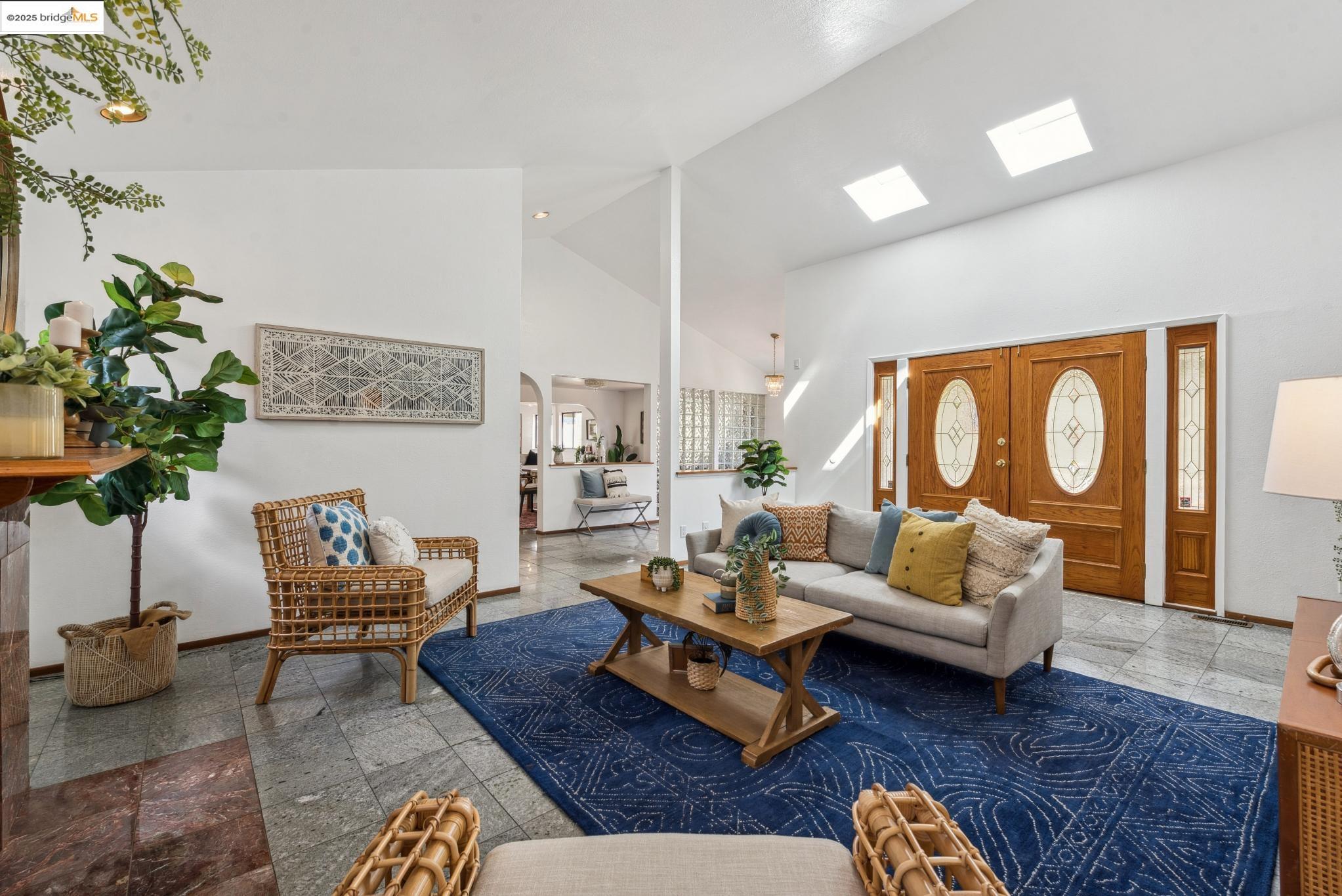 Undisclosed Address San Leandro, CA 94577 - Photo 7 of 50 a living room with furniture potted plant and a rug