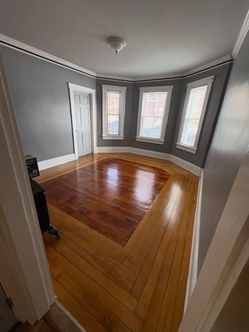 7 Dupont Street, Unit 1L Worcester, MA 01604 - Photo 3 of 7 a view of empty room with window and wooden floor