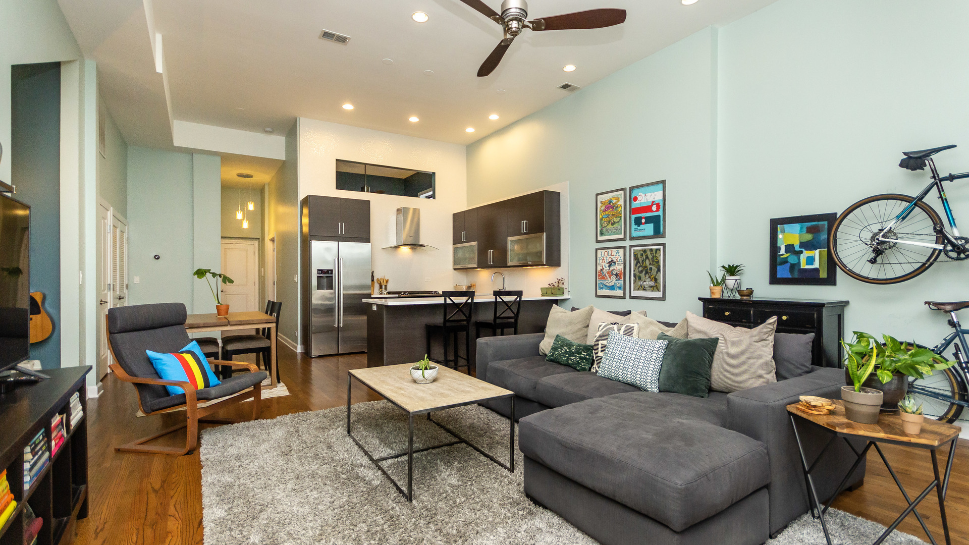 2112 West Rice Street, Unit 1 Chicago, IL 60622 - Photo 3 of 14 a living room with furniture and a flat screen tv