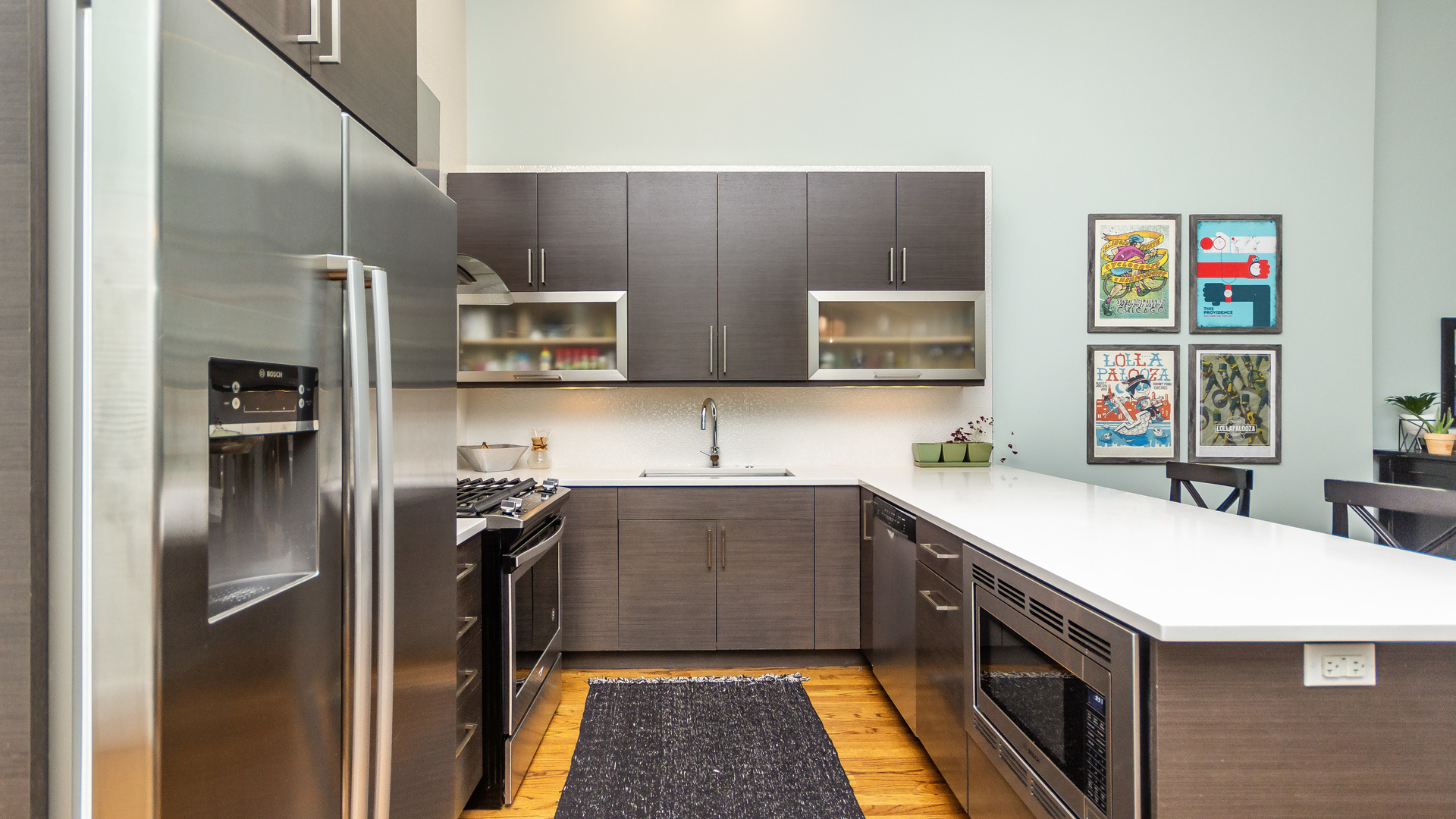 2112 West Rice Street, Unit 1 Chicago, IL 60622 - Photo 7 of 14 a kitchen with stainless steel appliances a sink a stove and a refrigerator