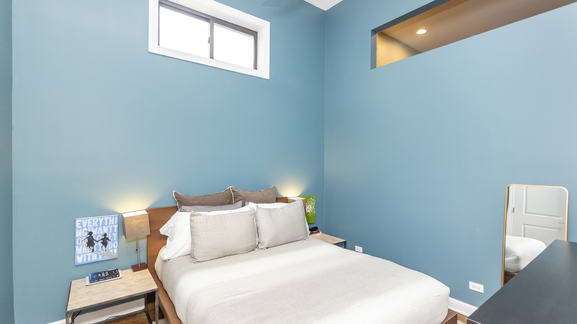 2112 West Rice Street, Unit 1 Chicago, IL 60622 - Photo 8 of 14 a bedroom with a bed and a night stand
