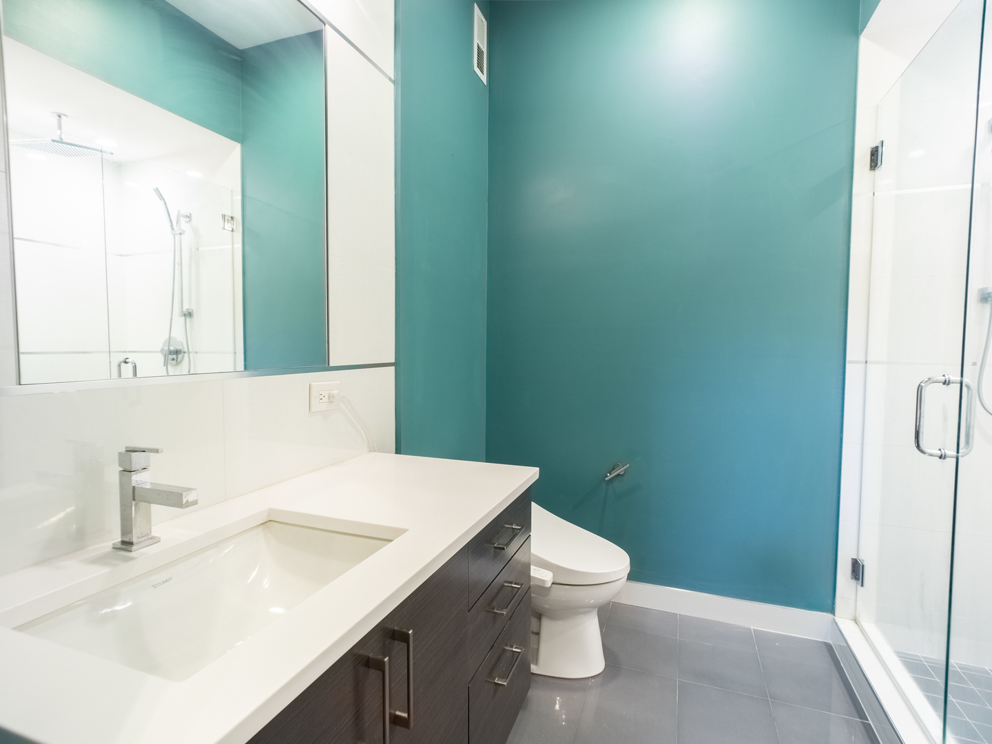 2112 West Rice Street, Unit 1 Chicago, IL 60622 - Photo 9 of 14 a bathroom with a sink a toilet and shower
